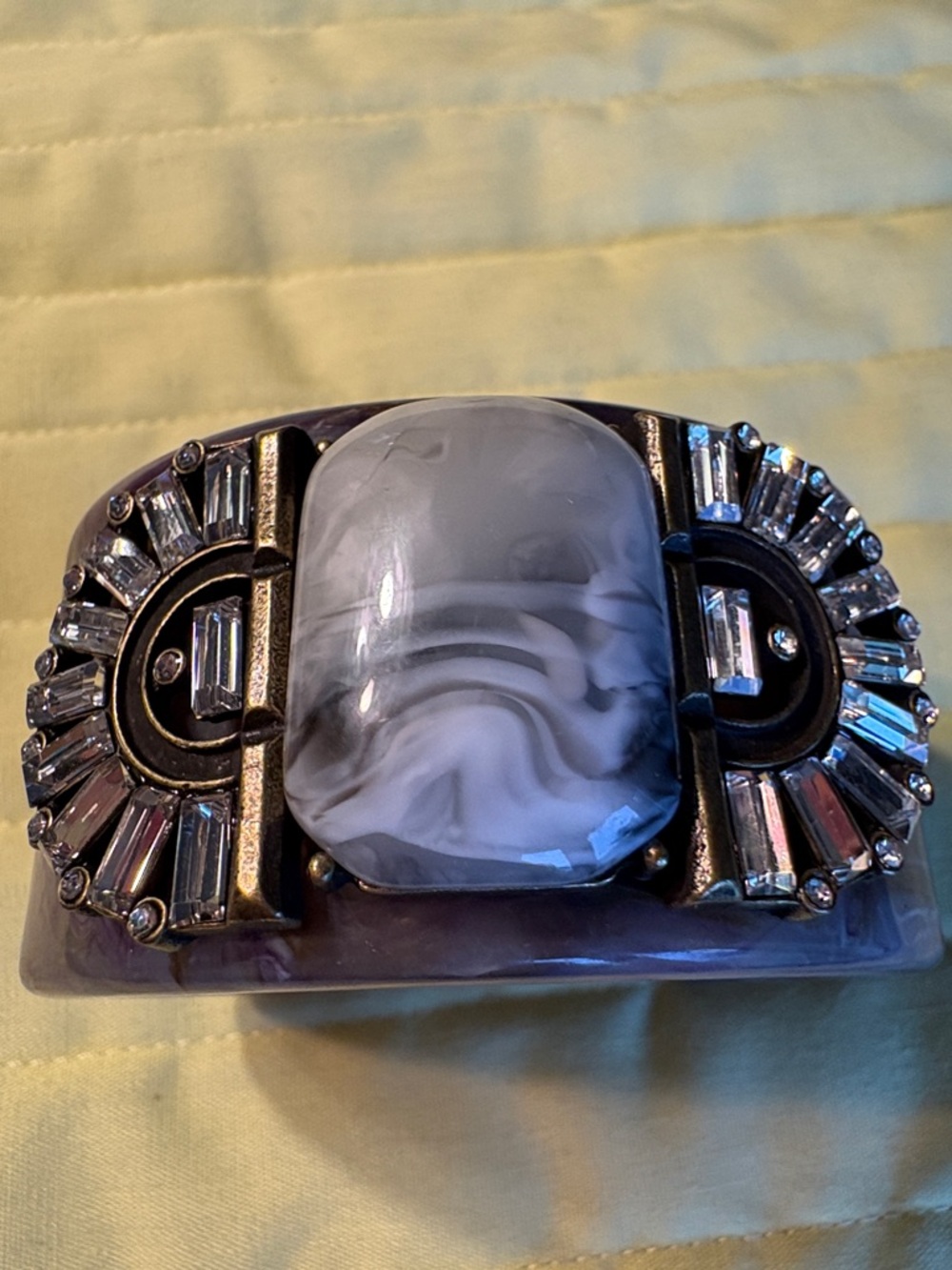 Plunder Purple Resin Bracelet with Marbled Center and Crystal Accents. $19